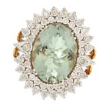 A PRASIOLITE AND DIAMOND CLUSTER RING set with an oval mixed cut prasiolite of approximately 14.55
