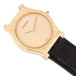 A LADIES WRIST WATCH, BOUCHERON in yellow gold, with gold dial and black leather strap, signed