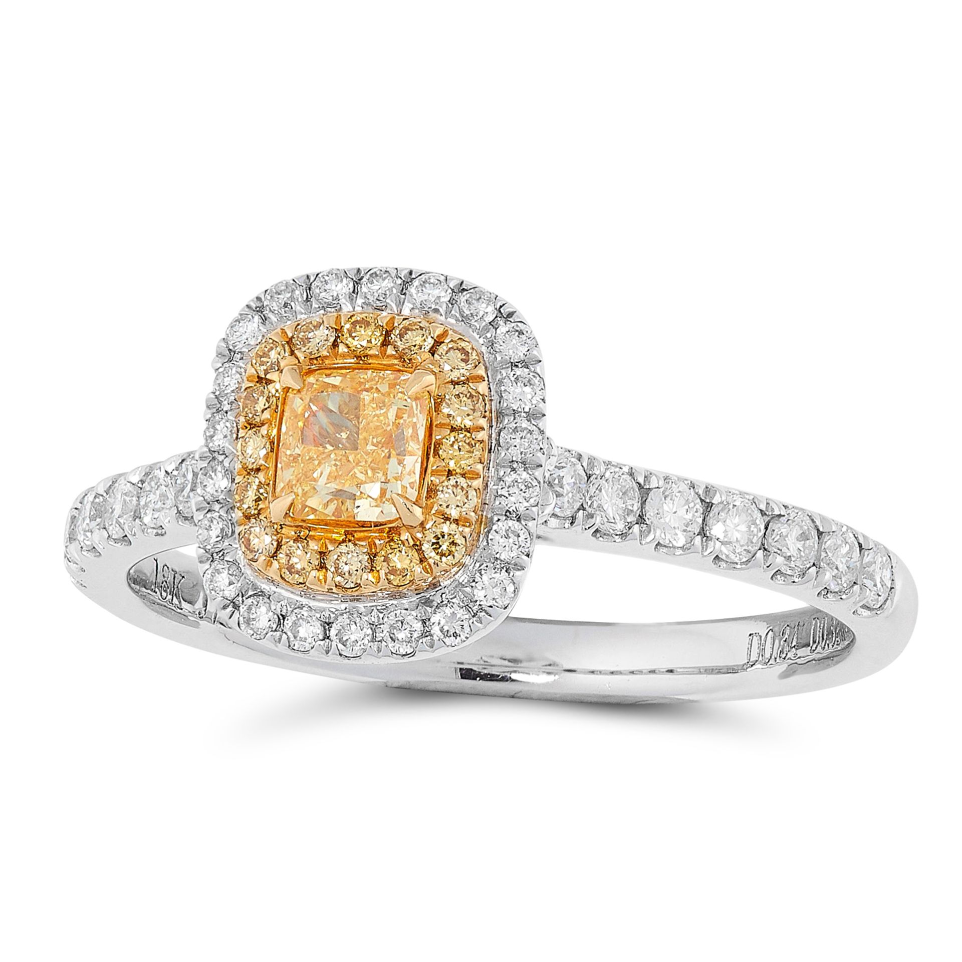 A FANCY YELLOW DIAMOND CLUSTER RING set with a fancy yellow cushion cut diamond of 0.34 carats in