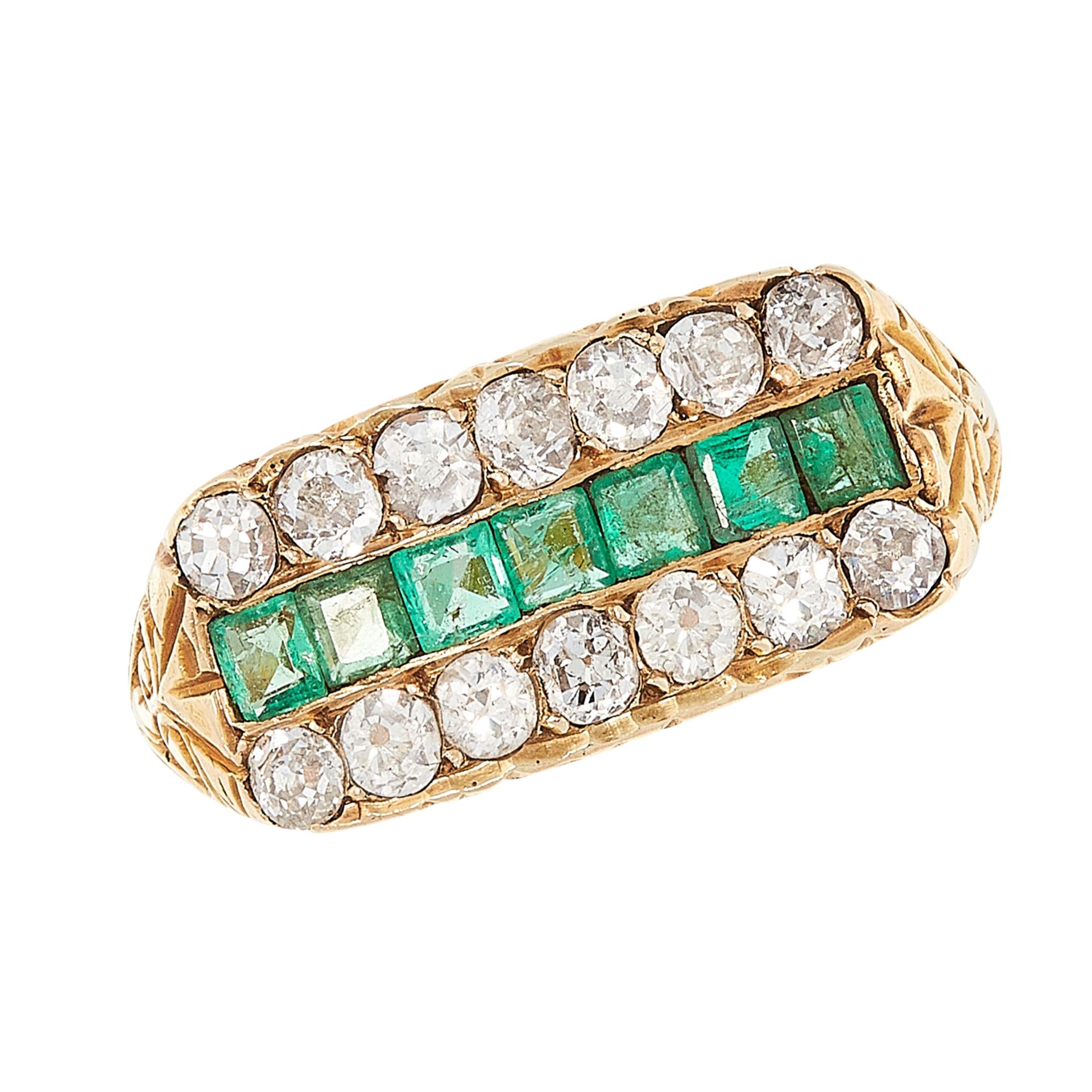 AN ANTIQUE VICTORIAN EMERALD AND DIAMOND RING in high carat yellow gold, comprising a row of step