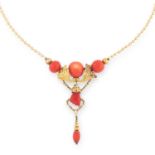 AN ANTIQUE CORAL NECKLACE comprising of three coral beads in foliate motif suspending a carved coral