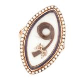 AN ANTIQUE PEARL AND ENAMEL HAIRWORK RING comprising of a curl of hair in a locket set with blue