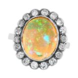 AN ANTIQUE ART DECO OPAL AND DIAMOND CLUSTER RING, EARLY 20TH CENTURY in platinum, set with an