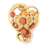 AN ANTIQUE CORAL BROOCH in floral design set with cabochon coral, 4.8cm, 8.8g.