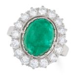 AN EMERALD AND DIAMOND CLUSTER RING set with an oval cabochon emerald of 3.72 carats in a cluster of