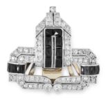 AN ONYX AND DIAMOND CLIP BROOCH in Art Deco design, set with polished onyx and old and round cut