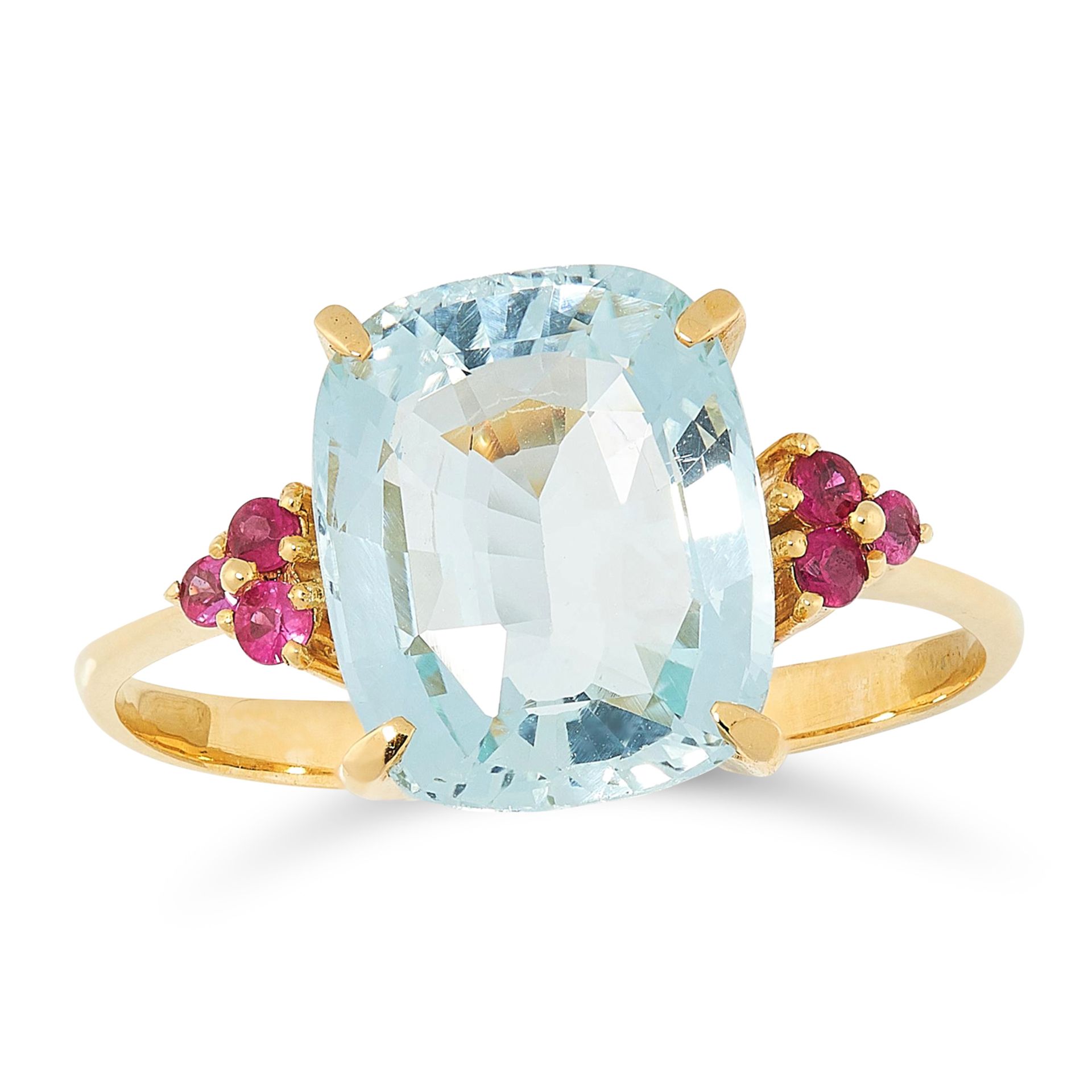 AN AQUAMARINE AND RUBY RING in yellow gold, set with a cushion cut aquamarine between trios of round
