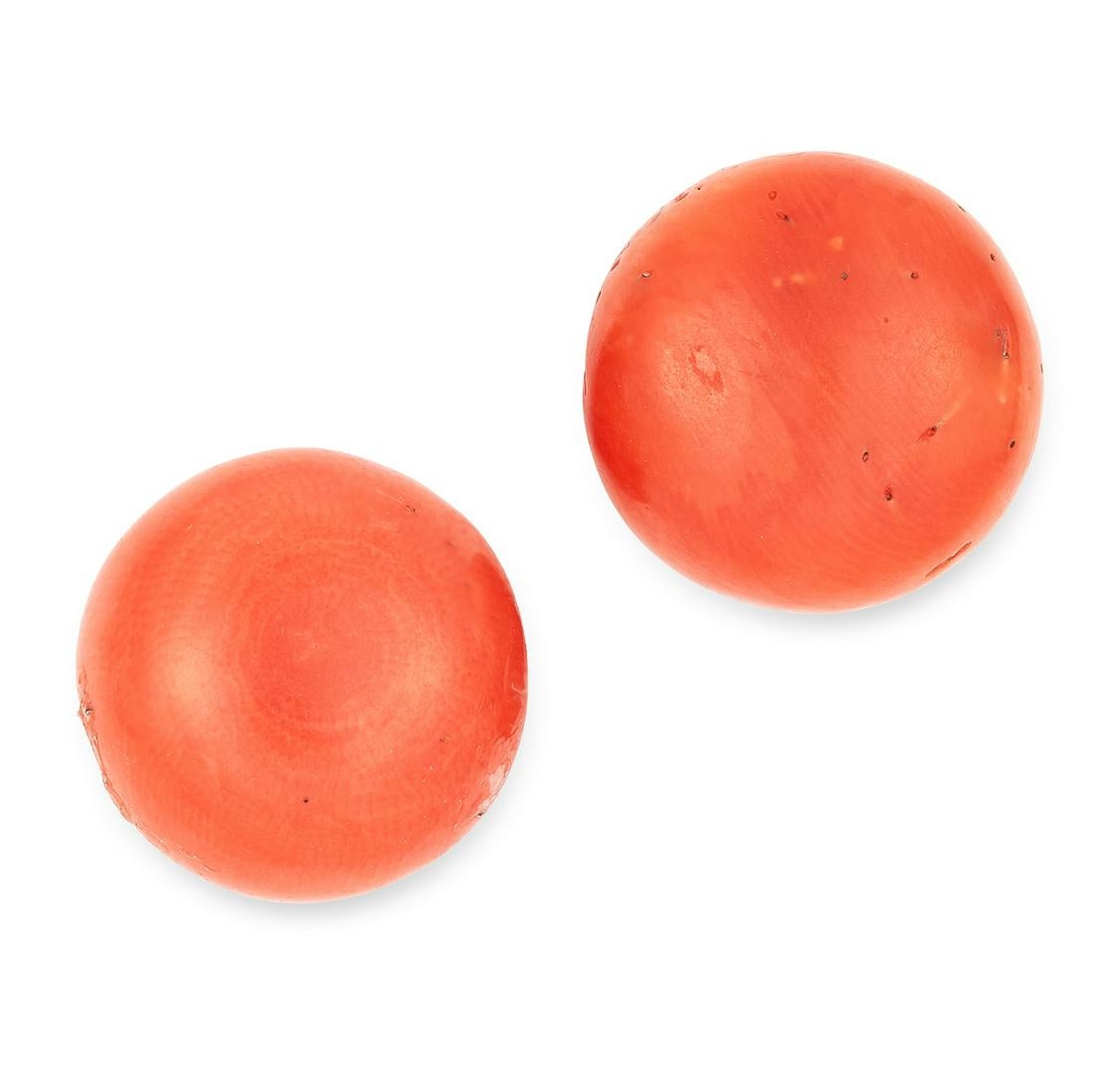 A PAIR OF ANTIQUE CORAL STUD EARRINGS in yellow gold, each set with a polished coral bead of 7.7-7.