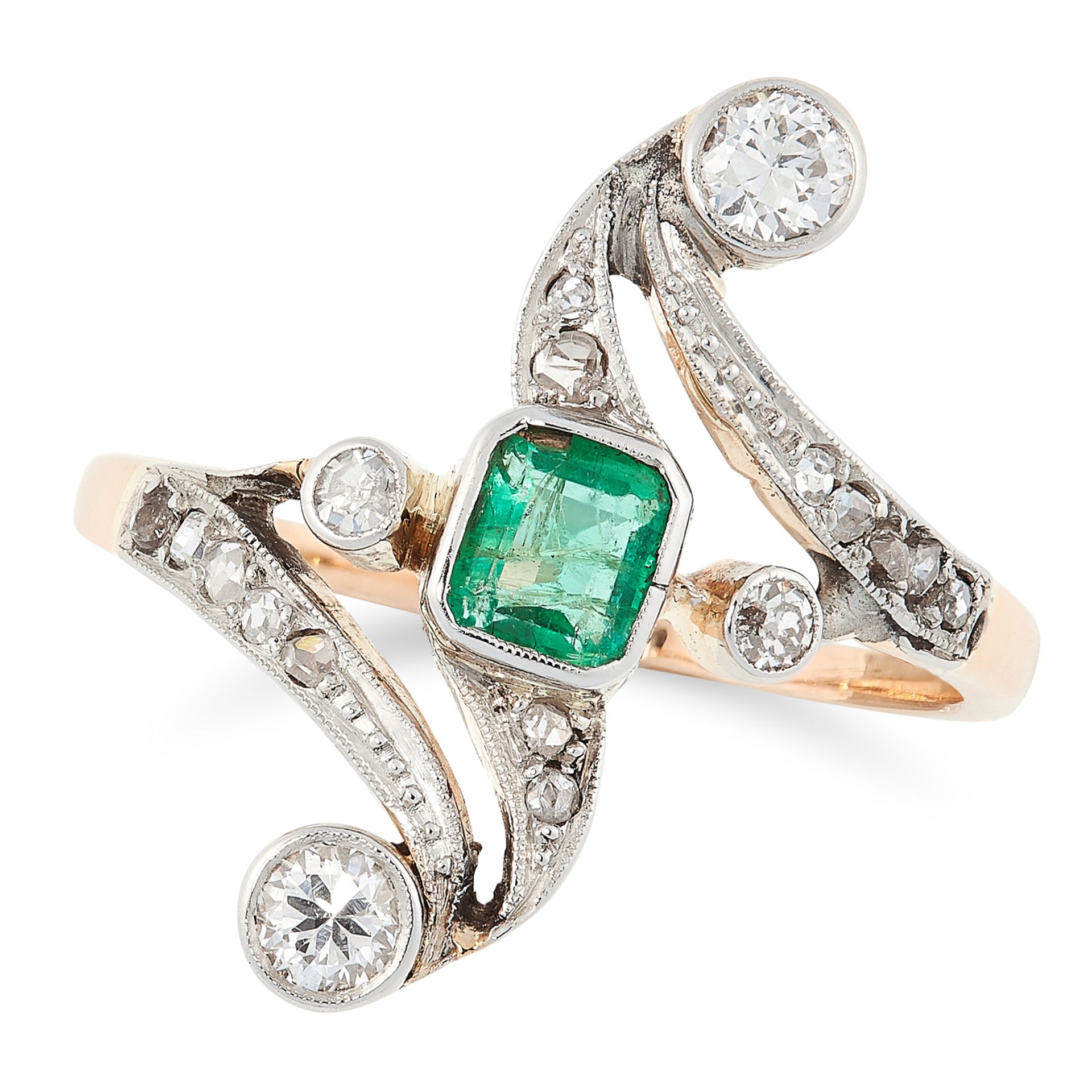 AN EMERALD AND DIAMOND RING in 14ct yellow gold, in open scrolling framework set with an emerald cut