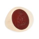 AN ANTIQUE CARNELIAN SIGNET RING in yellow gold, set with an oval carved carnelian intaglio