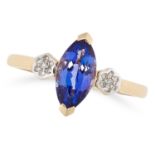 A TANZANITE AND DIAMOND RING in 14ct yellow gold, set with a marquise cut tanzanite in a border of