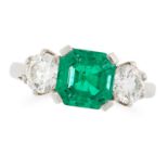 AN EMERALD AND DIAMOND THREE STONE RING in platinum, set with an emerald cut emerald of 1.56