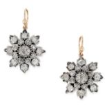 A PAIR OF ANTIQUE DIAMOND FLOWER EARRINGS in yellow gold, depicting a flower head set with old cut