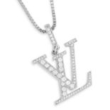 A DIAMOND LV PENDANT, LOUIS VUITTON in 18ct white gold, designed as the Louis Vuitton logo, set with