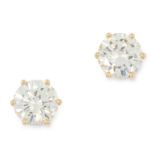 A PAIR OF DIAMOND STUD EARRINGS set with two round cut diamonds totalling 2.64 carats, tests as 18ct
