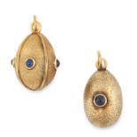 A PAIR OF SAPPHIRE SET EGG PENDANTS / CHARMS, FABERGE one jewelled with four sapphire cabochons,