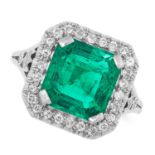 A COLOMBIAN EMERALD AND DIAMOND CLUSTER RING set with an emerald cut emerald of 2.84 carats in a