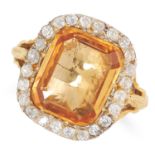 AN ANTIQUE IMPERIAL TOPAZ AND DIAMOND CLUSTER RING in high carat yellow gold, set with a cushion cut