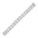 AN ART DECO DIAMOND BRACELET in platinum, the pierced open framework is set with old cut diamonds