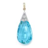 AN ART DECO AQUAMARINE AND DIAMOND PENDANT in high carat gold, set with a pear shaped briolette