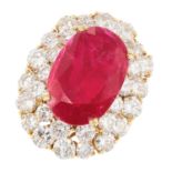 A 10.90 CARAT BURMA NO HEAT RUBY AND DIAMOND CLUSTER RING in 18ct yellow gold, comprising of an oval