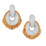 A PAIR OF FANCY YELLOW AND WHITE DIAMOND EARRINGS in oval design, set with round and tapered