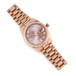 A LADIES OYSTER PERPETUAL DAY-DATE WRISTWATCH, ROLEX in 18ct rose gold, the rosé coloured dial,