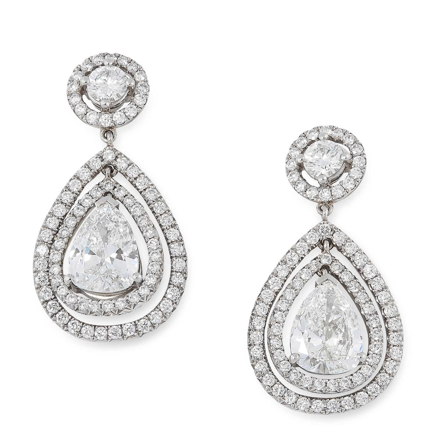 A PAIR OF DIAMOND DROP EARRINGS in white gold, each set with a pear cut diamond of 1.01 carats,