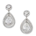 A PAIR OF DIAMOND DROP EARRINGS in white gold, each set with a pear cut diamond of 1.01 carats,