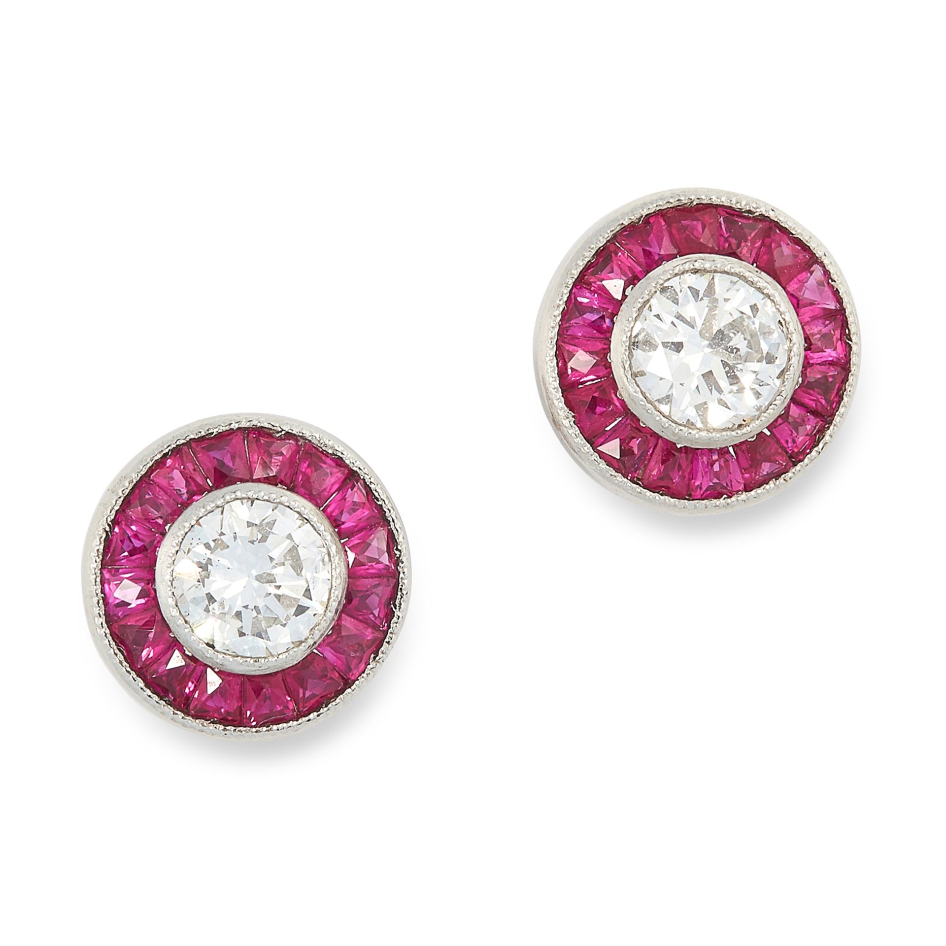 A PAIR OF DIAMOND AND RUBY TARGET EARRINGS each set with a round cut diamond within a border of