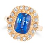 A BURMA NO HEAT SAPPHIRE AND DIAMOND CLUSTER RING set with an oval cushion cut sapphire of 3.89