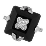 AN ONYX AND DIAMOND DRESS RING in Art Deco design, comprising of a polished piece of onyx set with