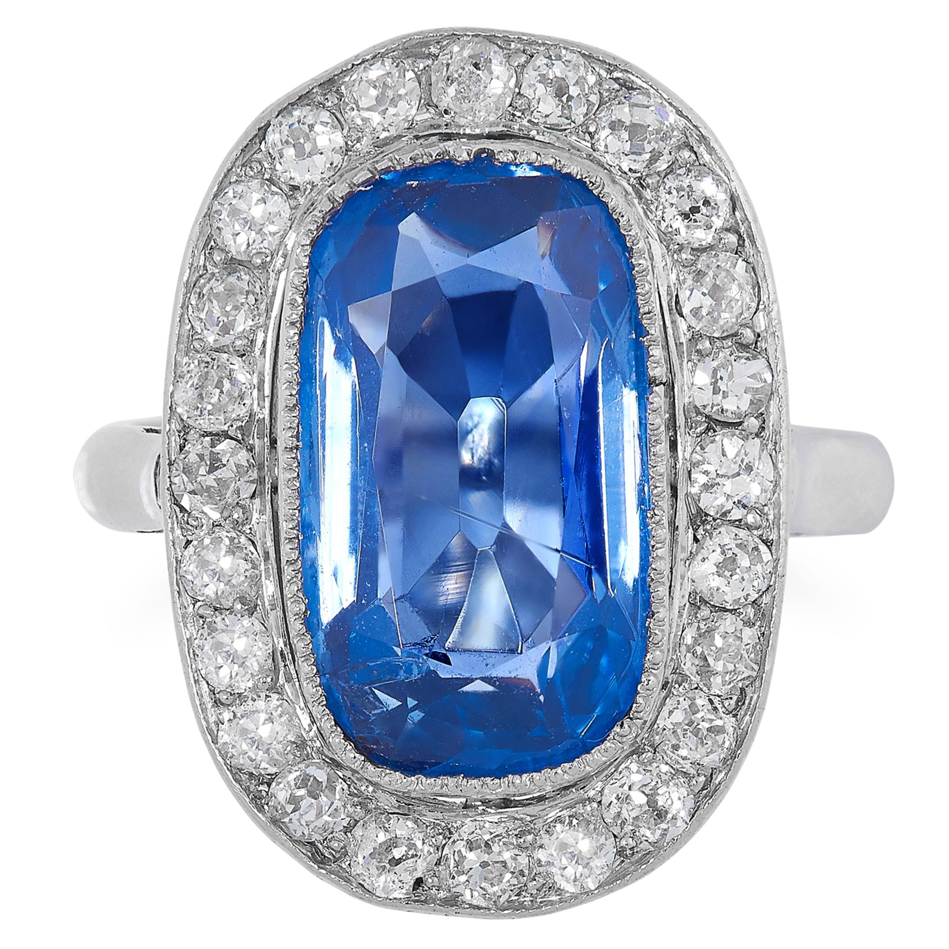 AN ART DECO 4.40 CARAT KASHMIR SAPPHIRE AND DIAMOND RING in palladium, set with a cushion cut