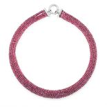 A RUBY BEAD NECKLACE set with five rows of faceted