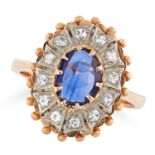 A SAPPHIRE AND DIAMOND CLUSTER RING set with an oval rose cut sapphire in a cluster of round