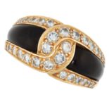 A VINTAGE ONYX AND DIAMOND CROSSOVER RING, VAN CLE