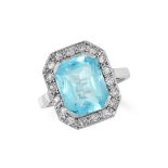 A BLUE TOPAZ AND DIAMOND CLUSTER RING set with a mixed cut blue topaz in a border of round brilliant