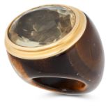 A TIGER'S EYE AND CITRINE DRESS RING comprising of a polished tiger's eye shank and central oval