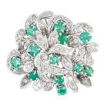 AN EMERALD AND DIAMOND DRESS RING, 1950s in foliate design set with round cut emeralds and round