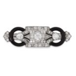 AN ART DECO ONYX AND DIAMOND BROOCH in 18ct white