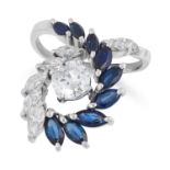 A DIAMOND AND SAPPHIRE DRESS RING set with a central round cut diamond of 1.0 carats, accented by