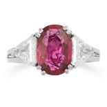 A RUBY AND DIAMOND THREE STONE RING set with an ov