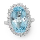 AN AQUAMARINE AND DIAMOND RING in 18ct white gold, set with an oval cut aquamarine of 7.38 carats