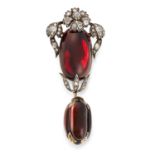 AN ANTIQUE GARNET AND DIAMOND MOURNING PENDANT / BROOCH, 19TH CENTURY in yellow gold and silver, the