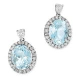 A PAIR OF AQUAMARINE AND DIAMOND EARRINGS in white gold, each set with an oval cut aquamarine of 4.
