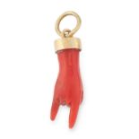 AN ANTIQUE CORNICELLO CORAL HAND PENDANT in yellow gold, set with a carved coral cornicello hand