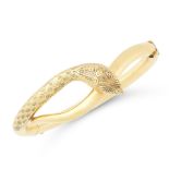AN ANTIQUE SNAKE BANGLE, CIRCA 1900 in yellow gold, designed as a snake coiled around on itself,