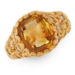 A CARVED CITRINE AND DIAMOND INTAGLIO RING in 18ct yellow gold, set with a cushion shaped citrine