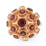 A VINTAGE GARNET SPUTKIN RING in yellow gold, in the manner of H Stern, the bombe design set with