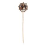AN ANTIQUE ESSEX CRYSTAL DOG TIE PIN in yellow gold, set with a circular reverse carved cameo